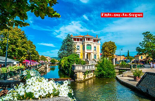 L'Isle-sur-la-Sorgue, ciudad provenzal con río y casas, para visitar cerca del camping.